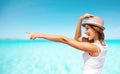 Happy young woman in hat on summer beach Royalty Free Stock Photo