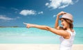 Happy young woman in hat on summer beach Royalty Free Stock Photo