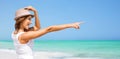 Happy young woman in hat on summer beach Royalty Free Stock Photo