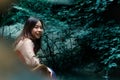 Happy young woman have a rest in garden near a pond. Royalty Free Stock Photo