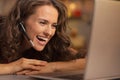 Happy young woman having christmas video chat on laptop Royalty Free Stock Photo