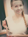 Happy young woman having mud mask on face Royalty Free Stock Photo