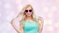 Happy young woman in heart shape sunglasses Royalty Free Stock Photo