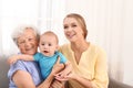 Happy young woman with her child and grandmother Royalty Free Stock Photo