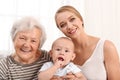 Happy young woman with her child and grandmother Royalty Free Stock Photo