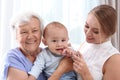 Happy young woman with her child and grandmother Royalty Free Stock Photo