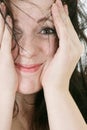 Happy young woman hides her face Royalty Free Stock Photo