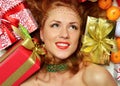 Happy young woman hold red Christmas wrapped gift present smiling Royalty Free Stock Photo