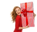 Happy young woman hold red Christmas wrapped gift present smiling Royalty Free Stock Photo