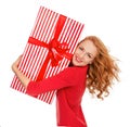 Happy young woman hold red Christmas wrapped gift present smiling surprised Royalty Free Stock Photo