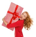 Happy young woman hold red Christmas wrapped gift present smiling surprised Royalty Free Stock Photo