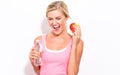 Happy young woman holding apple and water Royalty Free Stock Photo