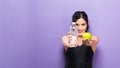 Happy young woman holding apple and water Royalty Free Stock Photo