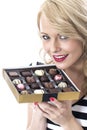 Happy Young Woman Holding Box of Chocolates Royalty Free Stock Photo