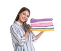 Happy young woman holding clean towels on white background Royalty Free Stock Photo