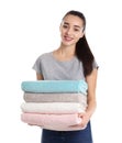 Happy young woman holding clean towels. Laundry day Royalty Free Stock Photo