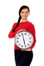 Happy young woman holding clock Royalty Free Stock Photo