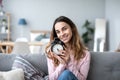 Happy young woman holding clock Royalty Free Stock Photo