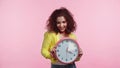 happy young woman holding clock isolated Royalty Free Stock Photo