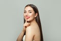 Happy young woman holding finger near lips. Secret and silence concept