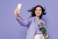 happy young woman holding flowers and Royalty Free Stock Photo