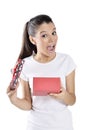 Happy young woman holding gift box