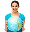 Happy Young Woman Holding Globe Royalty Free Stock Photo