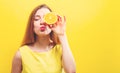 Happy young woman holding a half orange Royalty Free Stock Photo