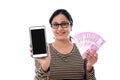 Happy young woman holding Indian currency and mobile phone Royalty Free Stock Photo