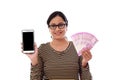 Happy young woman holding Indian currency and mobile phone Royalty Free Stock Photo