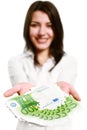 Happy young woman holding money