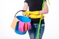 Happy young woman holding a mop and a bucket filled with cleaning products isolated on white background Royalty Free Stock Photo