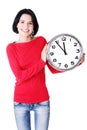 Happy young woman holding office clock Royalty Free Stock Photo