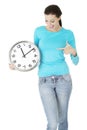 Happy young woman holding office clock Royalty Free Stock Photo