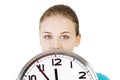 Happy young woman holding office clock Royalty Free Stock Photo