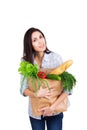 Happy young woman holding paper bag with groceries Royalty Free Stock Photo