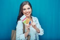 Happy young woman holding passport with ticket and credit card. Royalty Free Stock Photo