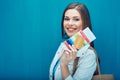 Happy young woman holding passport with ticket and credit card. Royalty Free Stock Photo