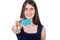 Happy young woman holding to camera a credit card. Close up portrait of a girl advertising a bank isolated on white background Royalty Free Stock Photo