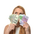 Happy young woman holding up cash money dollars and euros Royalty Free Stock Photo