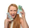 Happy young woman holding up cash money one hundred euro and dollars Royalty Free Stock Photo