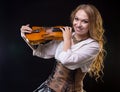 Happy young woman holding the violin Royalty Free Stock Photo