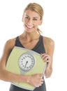 Happy Young Woman Holding Weight Scale Royalty Free Stock Photo