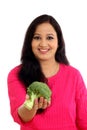 Happy young woman holdong broccoli against white Royalty Free Stock Photo