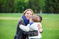 Happy young woman hugging two sons and laughing Royalty Free Stock Photo