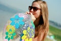 Happy young woman inflating the inflatable ball