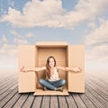 Happy young woman inside a Box Royalty Free Stock Photo