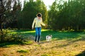 Happy young woman jogging with her Jack Russell terrier dog Royalty Free Stock Photo
