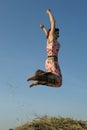 Happy young woman jumping Royalty Free Stock Photo