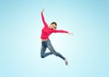 Happy young woman jumping in air or dancing Royalty Free Stock Photo